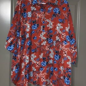 Orange top with flowers